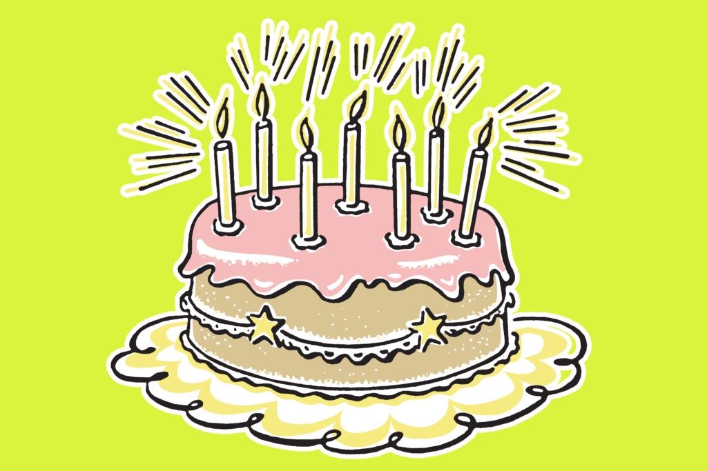 Birthday cake on green background