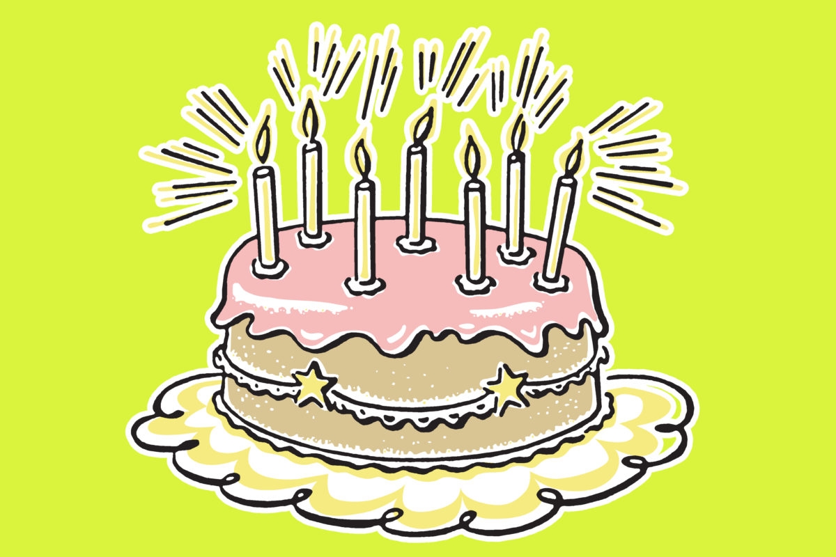 Birthday cake on green background