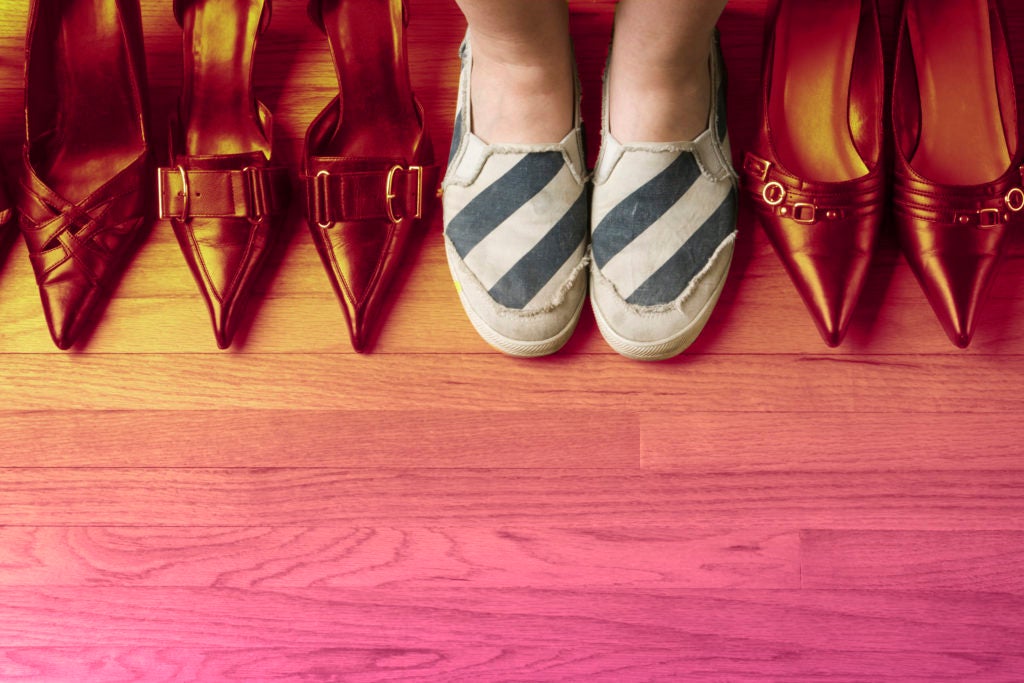 Woman Wearing Comfortable Sports Shoes with Dress Heels Variety Selection