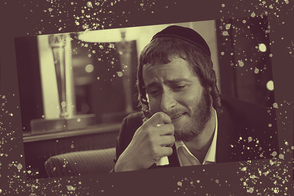 Michael Aloni in "Shtisel", crying