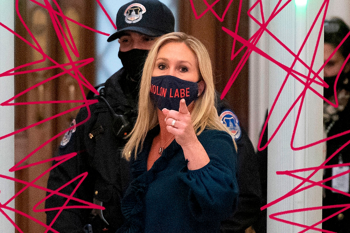 Representative Marjorie Taylor Greene (R-GA) shouts at journalists as she goes through security outside the House Chamber at Capitol Hill in Washington, DC on January 12, 2021. - On the eve of his likely impeachment, President Donald Trump on Tuesday denied responsibility for the storming of Congress by a mob of his supporters, and warned of "tremendous anger" across the country. (Photo by ANDREW CABALLERO-REYNOLDS / AFP) (Photo by ANDREW CABALLERO-REYNOLDS/AFP via Getty Images)