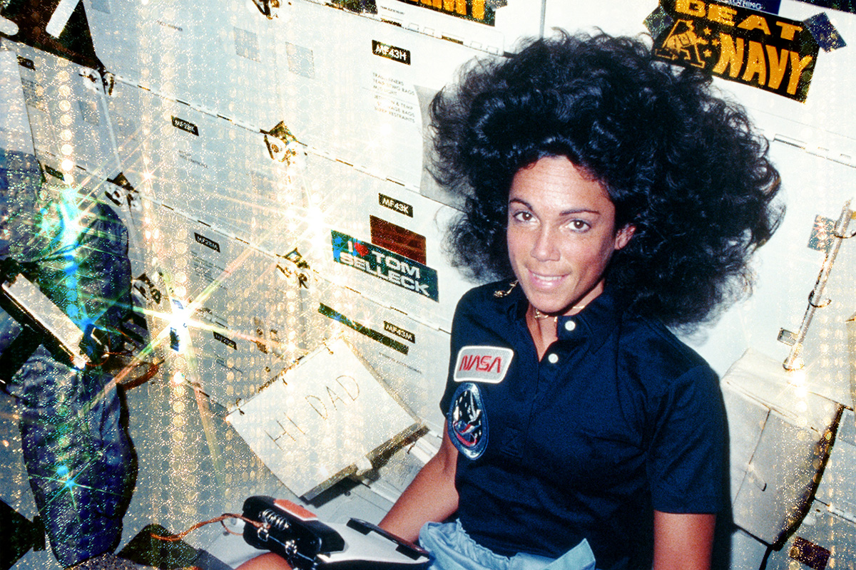 30th August 1984: Mission specialist Judith A Resnik sends a message to her father from on board the shuttle Discovery, on its maiden voyage STS-41D. Nearby, payload specialist Charles D Walker examines the contents of a storage locker. (Photo by NASA/Space Frontiers/Getty Images)