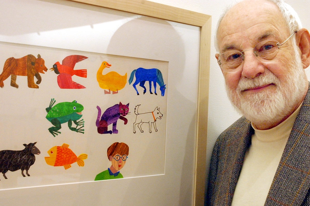 AMHERST, MA - NOVEMBER 13: Artist Eric Carle, an illustrator and author of children's books, with his work from the book, "The Mixed Up Chameleon." Carle was instrumental in the planning and building of the museum. (Photo by Matthew J. Lee/The Boston Globe via Getty Images)