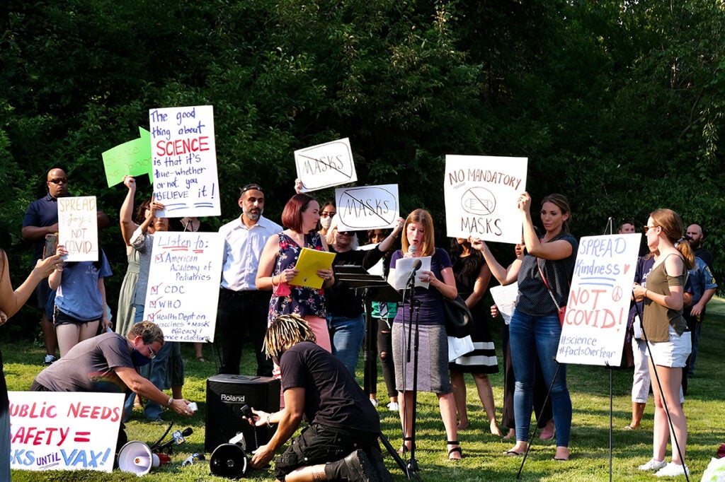 a group of anti-maskers protesting