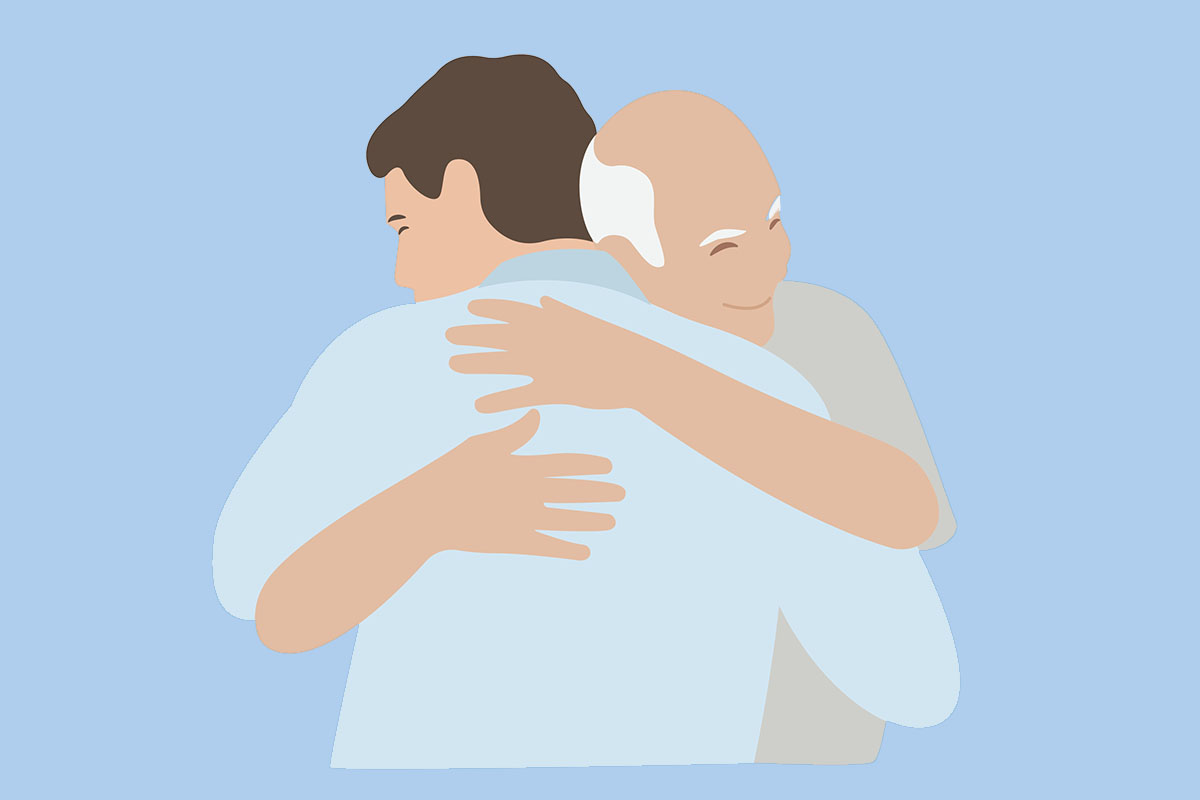 hugs man and elderly father