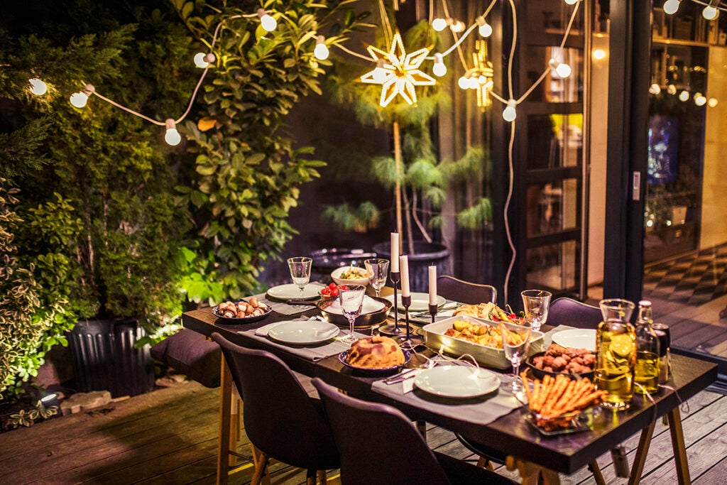 Table ready for dinner party at house backyard