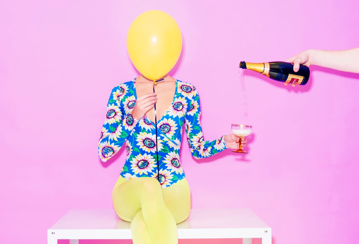 woman with balloon and champagne