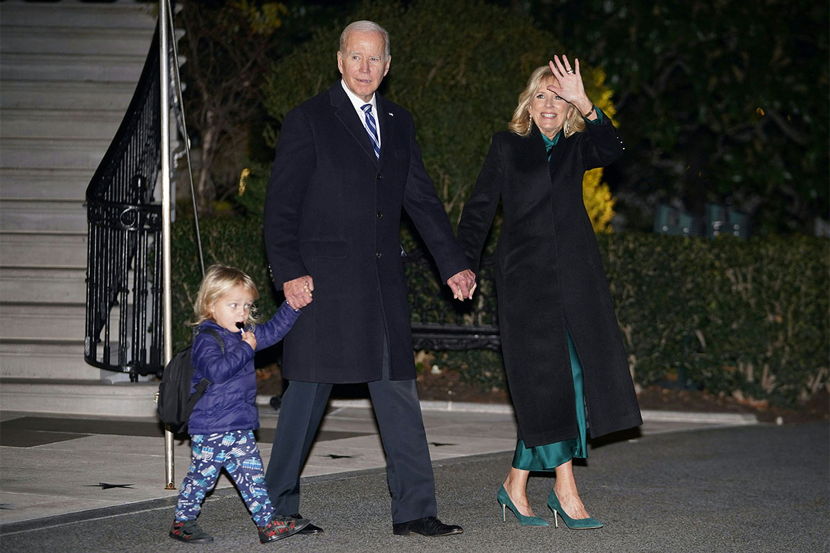 US President Joe Biden and First Lady Jill Biden with grandson Beau Biden Jr., make their way to board Marine One from the South Lawn of the White House in Washington, DC on December 16, 2022. - Biden is heading to Wilmington, Delaware where he is scheduled to spend the weekend at his residence.