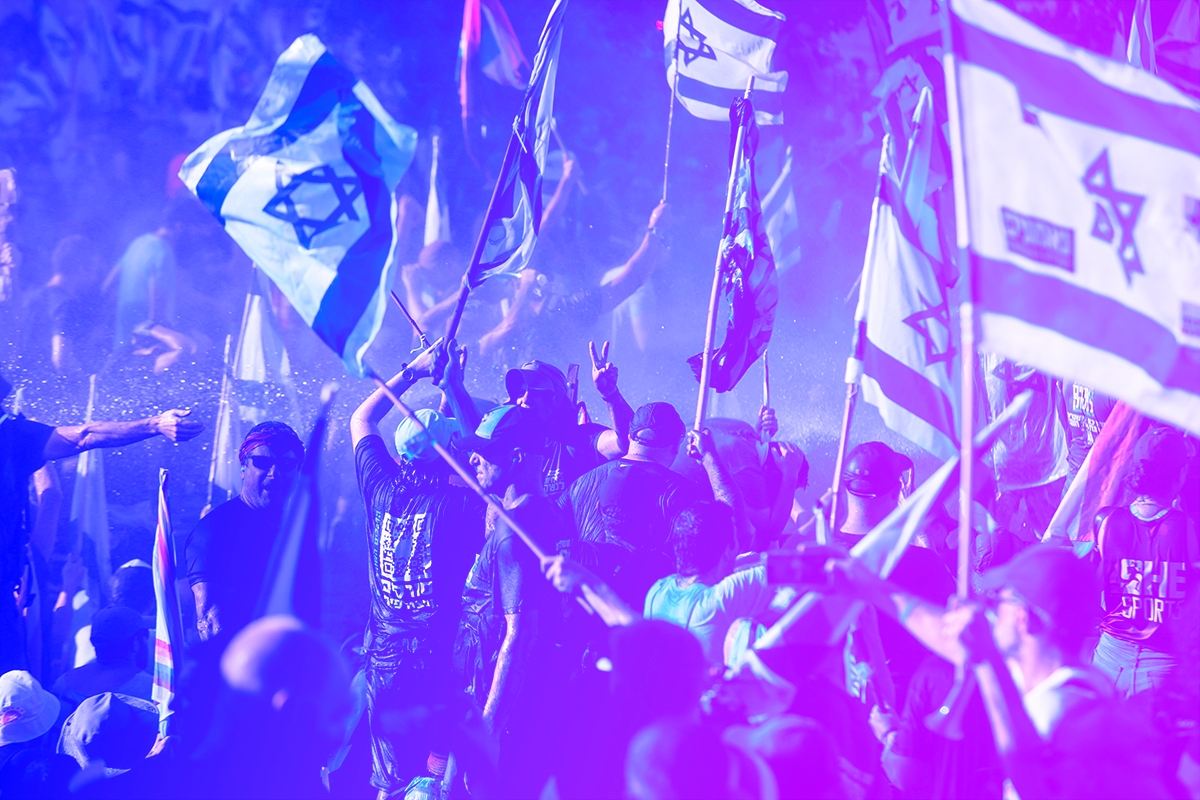 JERUSALEM, ISRAEL - JULY 24: Police officers use water cannons to evacuate protesters from a main road on July 24, 2023 in Jerusalem, Israel. Some 20, 000 anti-government protestors marched from Tel Aviv and converged in Jerusalem outside the parliament as the contested bill is voted, after weeks of protest against the government's plans to restrain the judiciary.