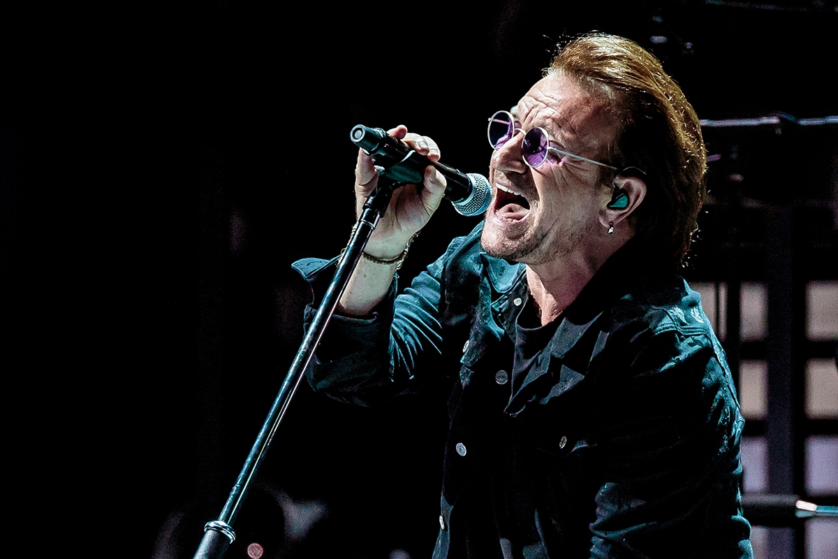MILAN, ITALY - OCTOBER 12: Bono of U2 performs on stage at Mediolanum Forum on October 12, 2018 in Milan, Italy.