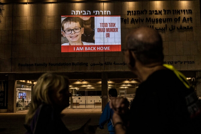 TEL AVIV, ISRAEL-NOVEMBER 24:A photo of Ohad Munder, 9, projected on the building of The Tel Aviv Museum of Art following his release from captivity in Gaza with his mother Keren Munder and grandmother Ruth on November 24,2023. They were kidnapped from her Nir Oz home. Her husband, Said (David) Moshe, was murdered. They were taken hostage by Hamas from Kibbutz Nir Oz on October 7.