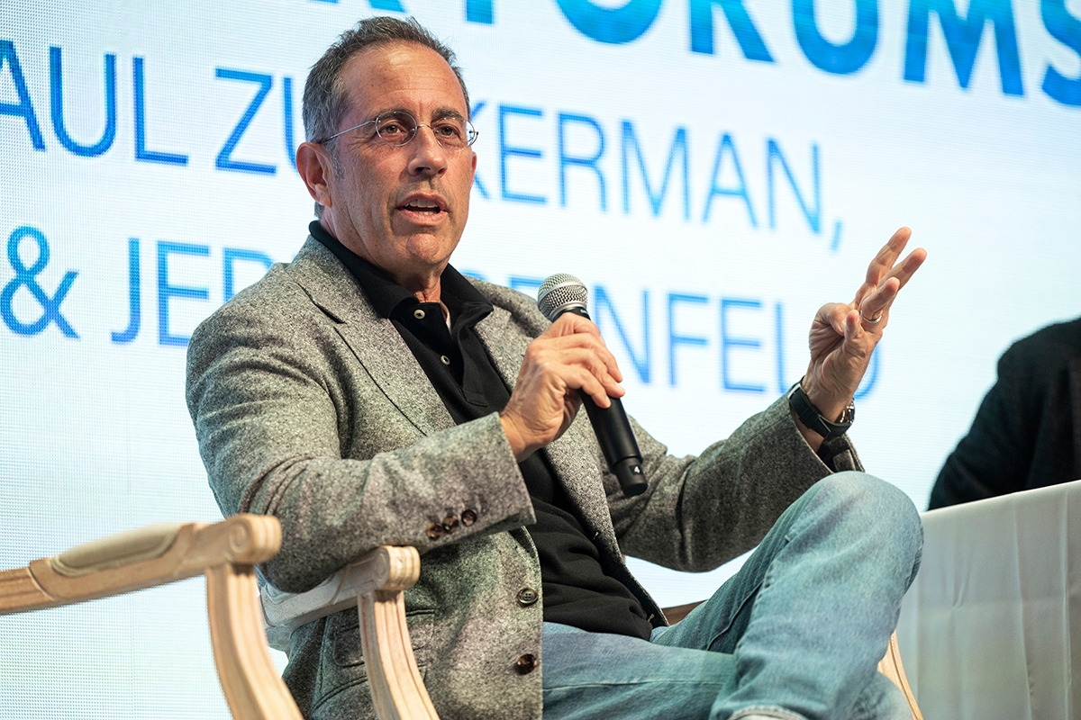 MONTEREY, CALIFORNIA - AUGUST 19: Jerry Seinfeld is seen on stage at the Classic Car Forum part of the Pebble Beach Concours d'Elegance on August 19, 2023 in Monterey, California.