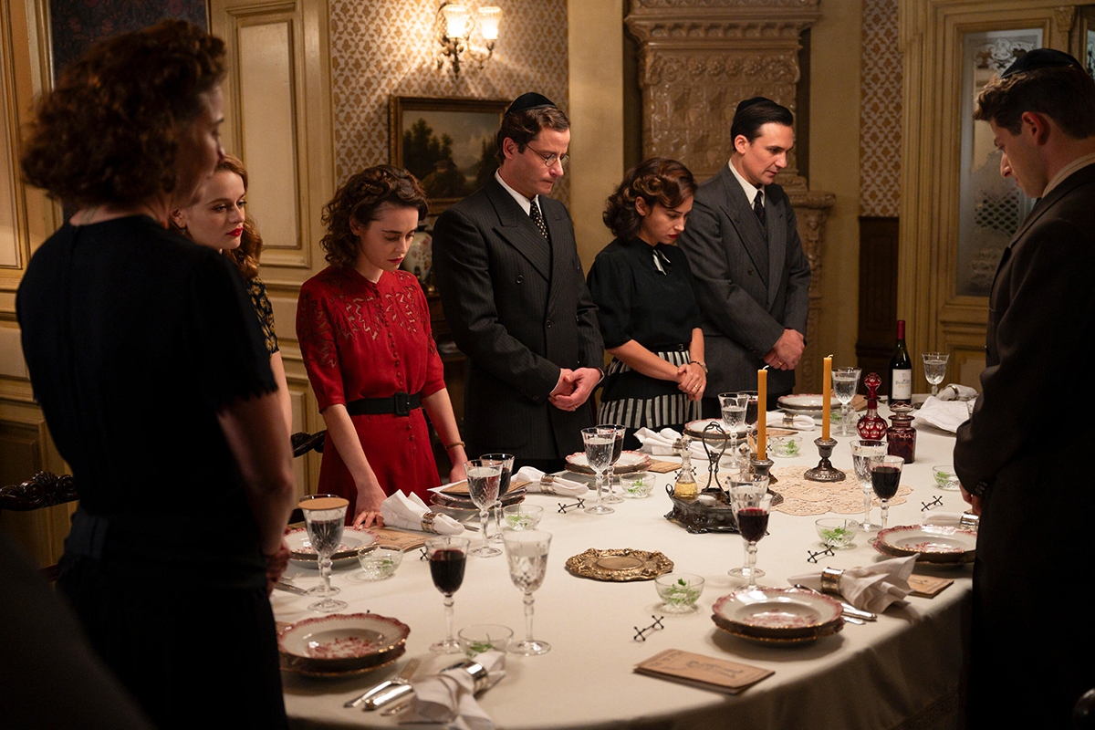 We Were the Lucky Ones -- “Radom” - Episode 101 -- The Kurc family celebrates Passover in Radom, Poland. One year later, the onset of World War II forces a devastating separation. Nechuma (Robin Weigert), Halina (Joey King), Mila (Hadas Yaron), Selim (Michael Aloni), Herta (Moran Rosenblatt), Genek (Henry Lloyd-Hughes) and Jakob (Amit Rahav), shown.