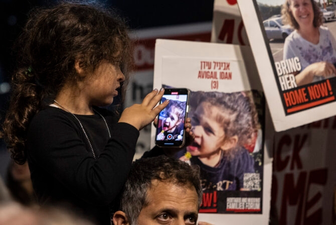 TEL AVIV, ISRAEL- NOVEMBER 25: A little girl takes a photograph