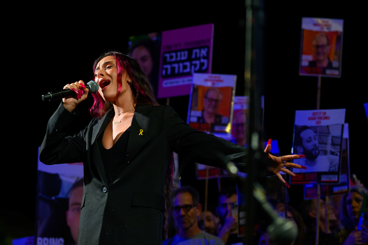 TEL AVIV, ISRAEL - MAY 18: Israel’s Eurovision contestant Eden Golan, sings her unsung version of “Hurricane” titled “October Rain” at the “International Rally - United We Bring Them Home” rally in Hostage Square on May 18th, 2024 in Tel Aviv, Israel. The rally calls for the immediate release of the 128 hostages from 24 countries that are still being held hostage in Gaza. Special guests included, American singer Montana Tucker, Eurovision winner Netta Barzilai, this year’s Israeli’s Eurovision contestant Eden Golan, and Ambassadors to Israel from the United States, United Kingdom, Germany and Austria, as well as relatives of the hostages. Moments before the rally started the IDF announced the retrieval of the body of hostage Ron Binyamin’s body from Gaza. On Friday the IDF announced the retrieval of hostages Itzhak Gelerenter Amit Buskila, and German-Israeli Shani Louk. All four were killed by Hamas on October 7th and their bodies were kidnapped to Gaza.