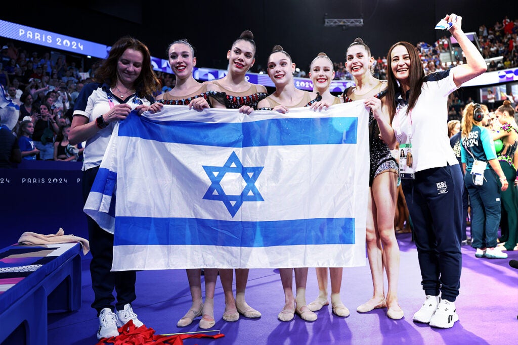 PARIS, FRANCE - AUGUST 10: Silver medalists Team Israel celebrates after comping in the Rhythmic Gymnastics Group All-Around Final on day fifteen of the Olympic Games Paris 2024 at Porte de La Chapelle Arena on August 10, 2024 in Paris, France.