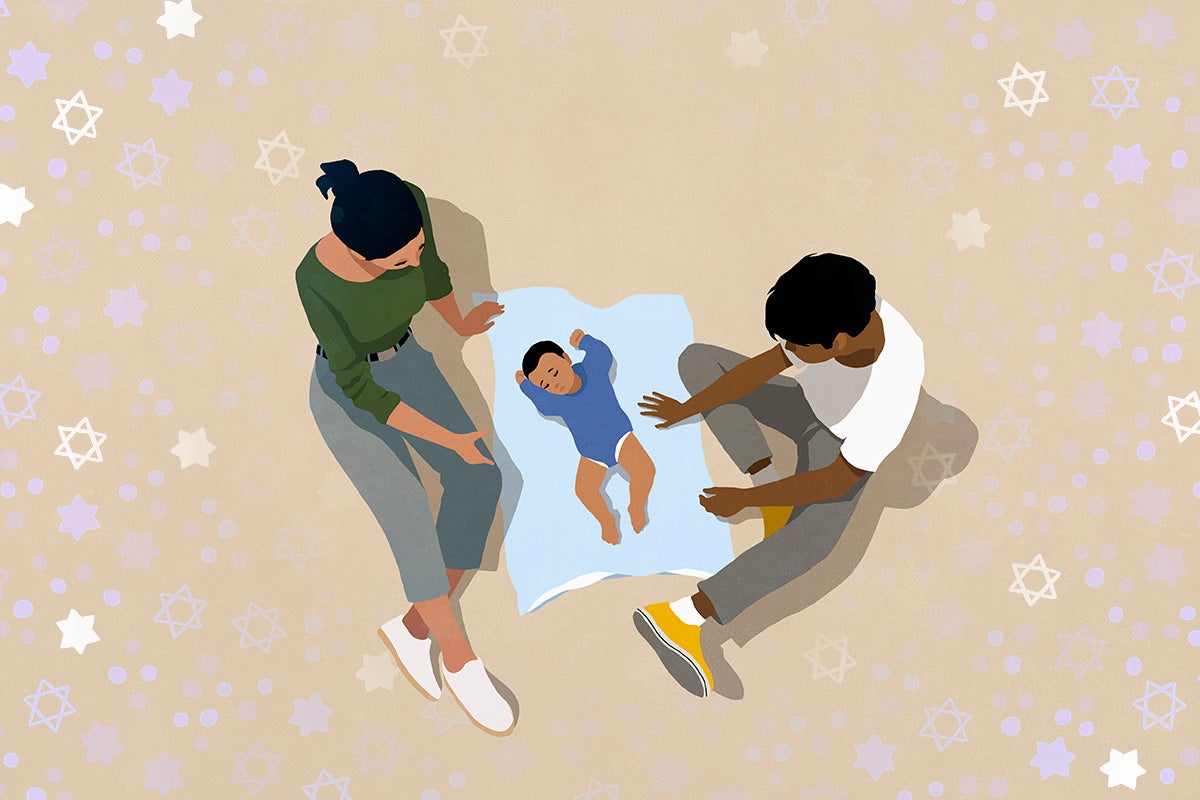 Parents watching baby son sleeping on blanket against beige background
