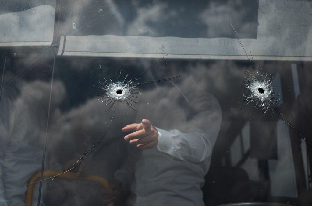 08 September 2025, Israel, Jerusalem: Gunshots are seen on a wind-shield of a bus at the bus stop where a shooting attack took place in Jerusalem. The Israeli emergency medical service reported that four victims were pronounced dead at the scene in north Jerusalem, while one died of her injuries later in hospital.