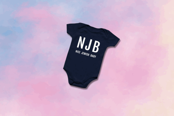 A navy onesie on a pastel gradient background.