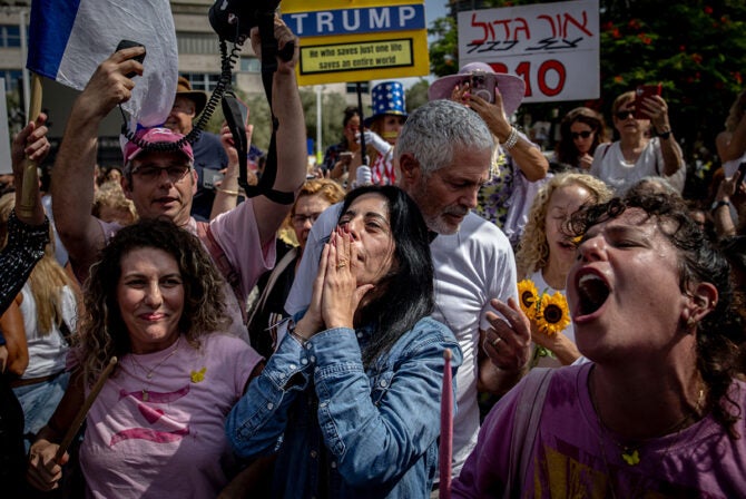 TEL AVIV, ISRAEL - OCTOBER 09: Einav Zangauker (blue shirt), the mother of hostage Matan Zangauker, celebrates as people react to the news of the Gaza peace deal at Hostages Square on October 09, 2025 in Tel Aviv, Israel. Overnight, the US president announced that Israel and Hamas had agreed to the first phase of a ceasefire plan that would see the release of hostages - held in Gaza after their capture on Oct. 7, 2023 - in the coming days. Israel's government is meeting today to formally approve the deal.