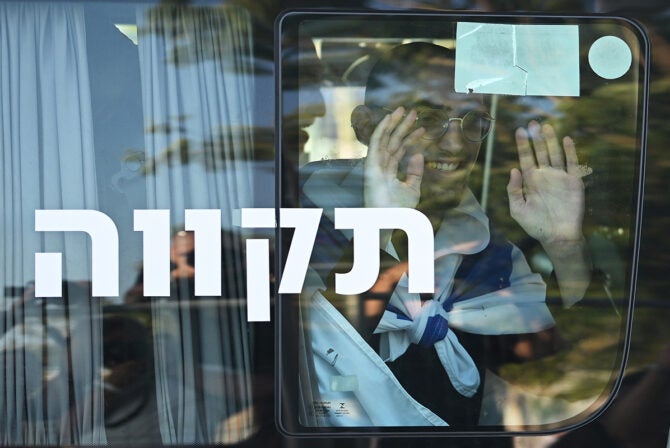 RAMAT GAN, ISRAEL - OCTOBER 13: Gaza hostage Maxim Herkin wavesMaxim Herkin as he arrives at Chaim Sheba Medical Center at Tel HaShomer on October 13, 2025 in Ramat Gan, Israel. The ceasefire deal between Israel and Hamas has brought an end to the two years of war that followed the attacks of Oct. 7, 2023. A condition of the deal was the immediate return of 48 hostages held in Gaza, around 20 of whom were believed to be alive.